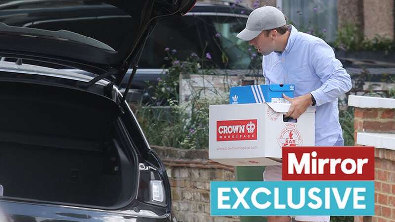 Hancock loading items into a car outside his former home in London (Image: brennanpix@aol.com)