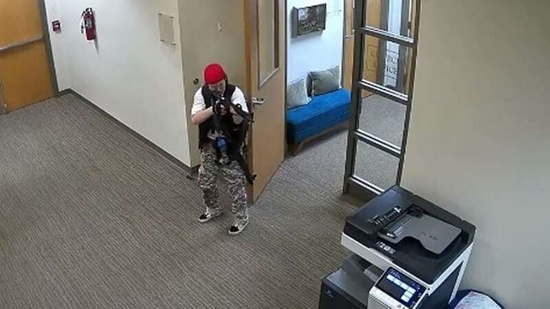 CCTV shows moment US school shooter storms building armed with assault rifles