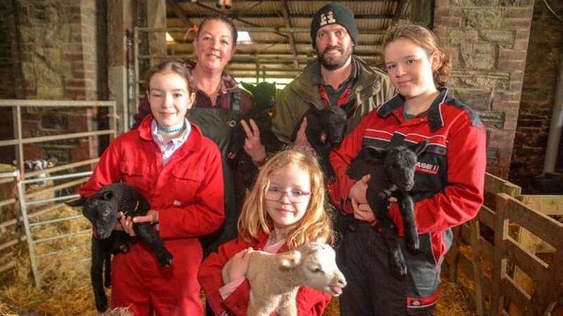 Adrianne and Simon with children Jorja, Tayla and Daisy Bulled at their West Buckland farm, Buckingham’s Leary, with five lambs