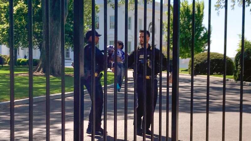 The toddler crawled through the White House fence (Image: AP)