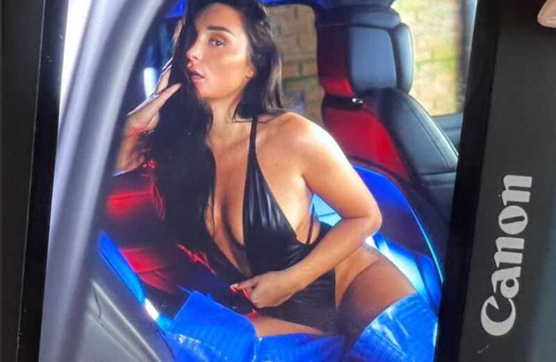 Love Island's Coco Lodge flashes her cleavage in a tight black bodysuit