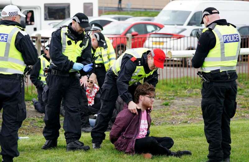 Protesters target Scottish Grand National as animal activists stopped by police