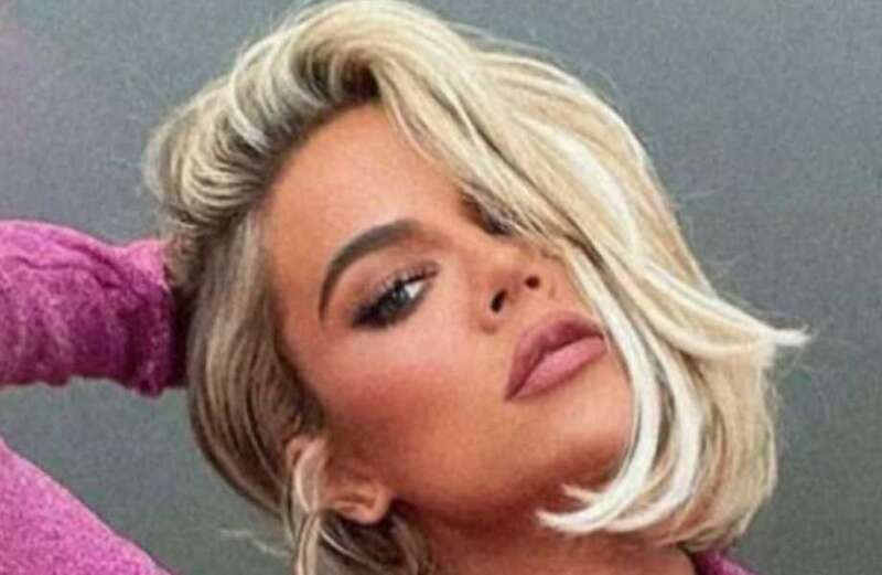 Khloe's tiny pink bikini bottoms nearly fall off her waist