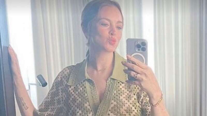 Pregnant Lindsay Lohan glows in first selfie showing blossoming baby bump