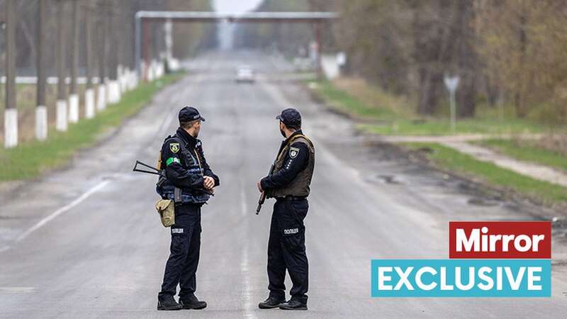 Ukrainian police stand guard during a ceremony marking the 36th anniversary of the Chernobyl Nuclear Power Plant disaster on April 26 last year (Image: Getty Images)