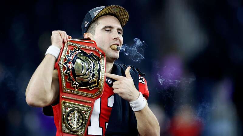 Stetson Bennett celebrates with a cigar after defeating the TCU Horned Frogs in the College Football Playoff National Championship game at SoFi Stadium on January 9. (Image: Steph Chambers/Getty Images)