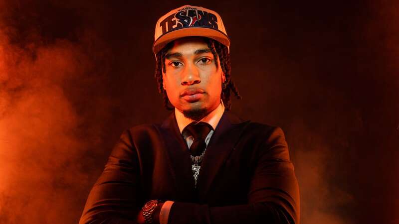 CJ Stroud poses after being selected second overall pick by the Houston Texans on April 27. (Image: Todd Rosenberg/Getty Images)