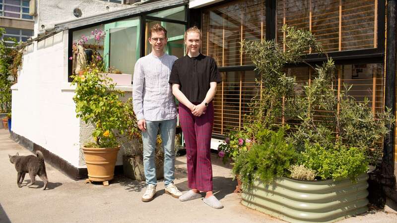 Douglas Harrison and Beth Higham-Edwards in the front garden of their flat on the Vanbrugh Park estate (Image: Copyright Unknown)