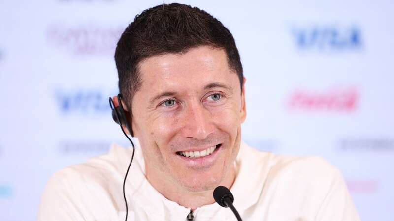 Robert Lewandowski wants Barcelona to bring back Lionel Messi (Image: FIFA via Getty Images)