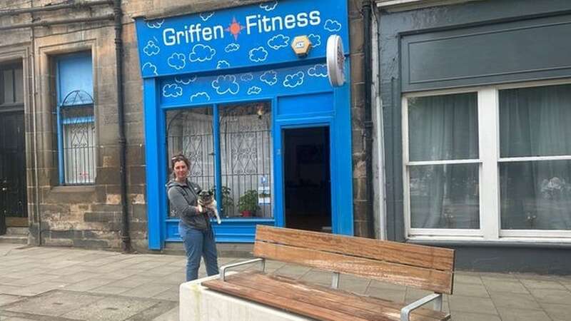 Tracey outside the business with the large bench installed on the street outside (Image: Steven Brown)