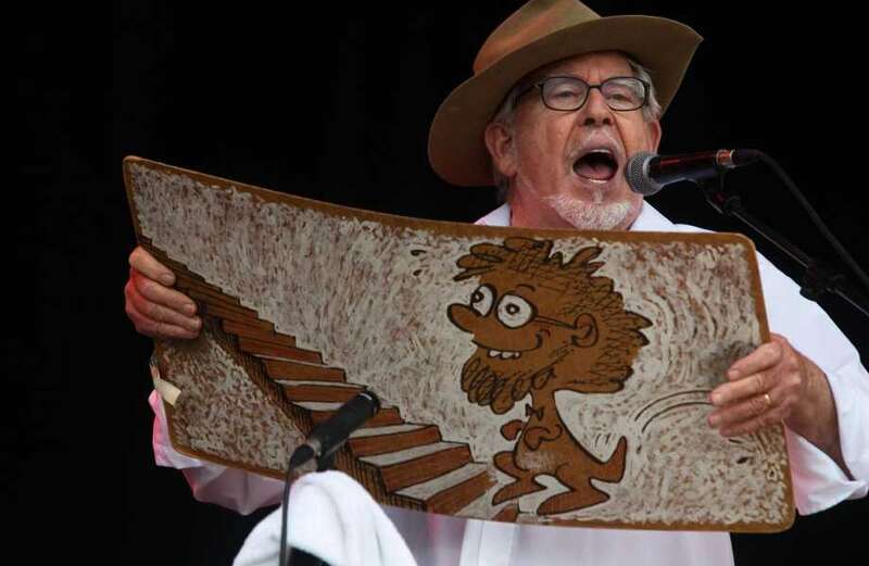 What songs did Rolf Harris sing and what instrument did he invent?