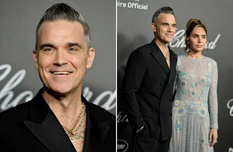 Robbie Williams looks slimmer than ever as he poses with wife Ayda