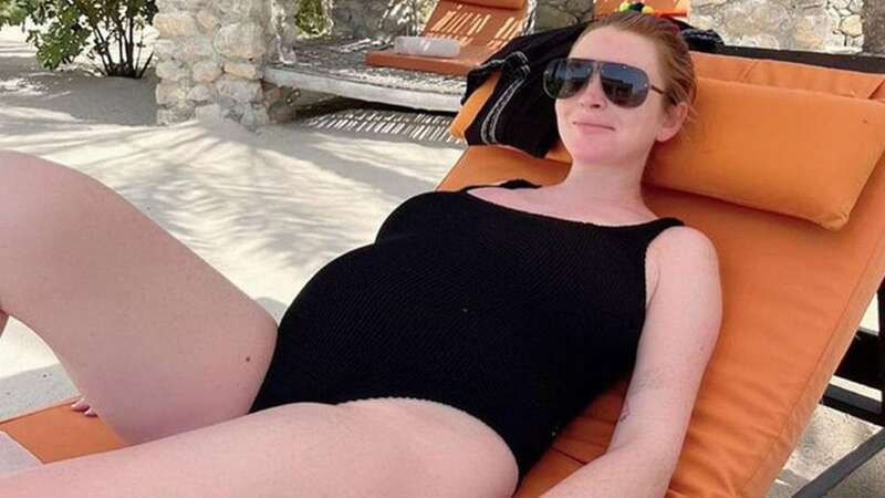 Pregnant Lindsay Lohan glows as she shows off blossoming baby bump in swimsuit