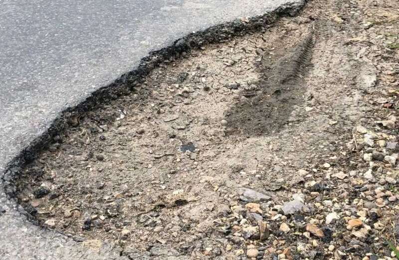 Locals’ fury as cop says potholes are good — because they ‘slow down traffic’