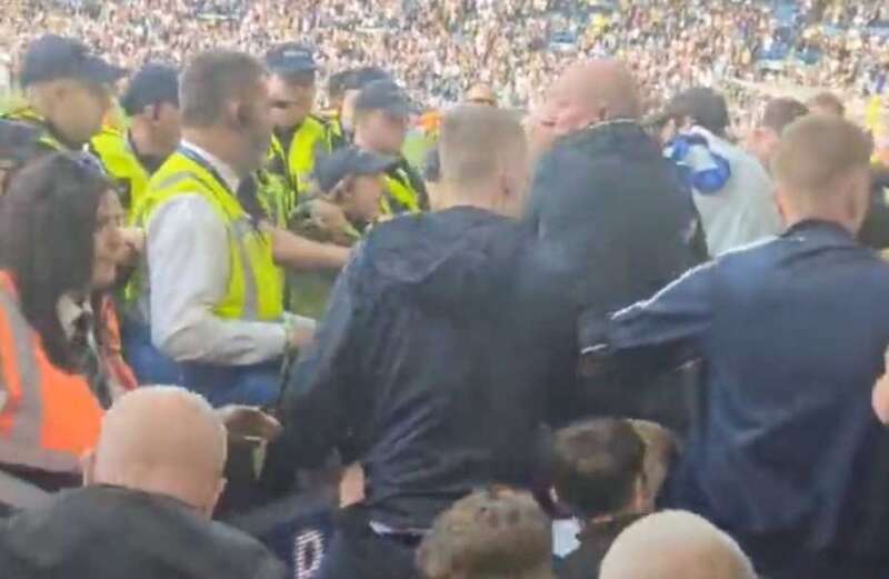 Moment Leeds United fans clash with police following relegation from Prem