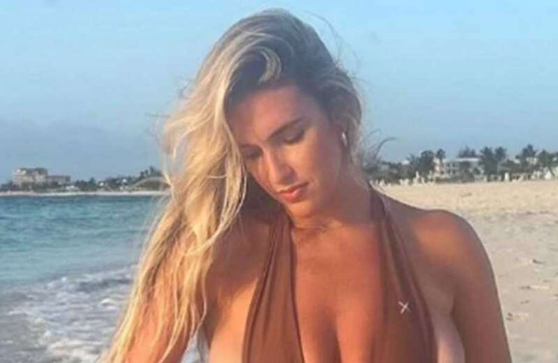 Kayla Simmons shows off crazy sideboob in barely-there swimsuit on beach trip