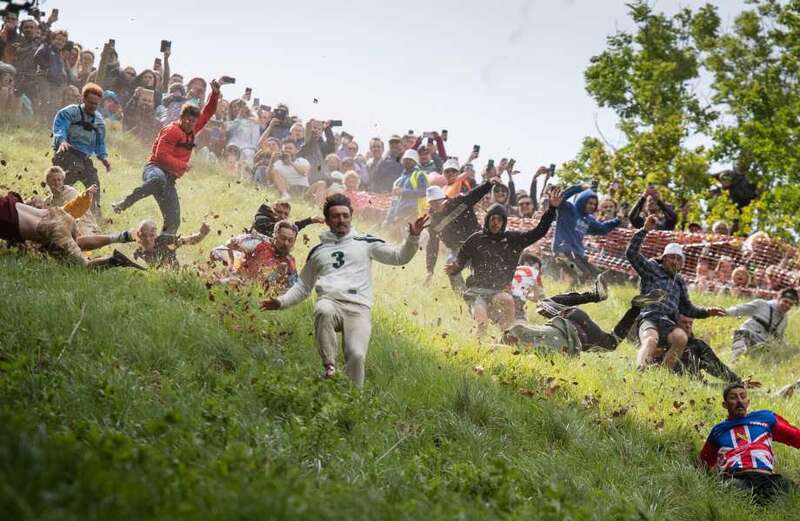 Daredevils race down dangerous hill chasing a 7lb Double Gloucester