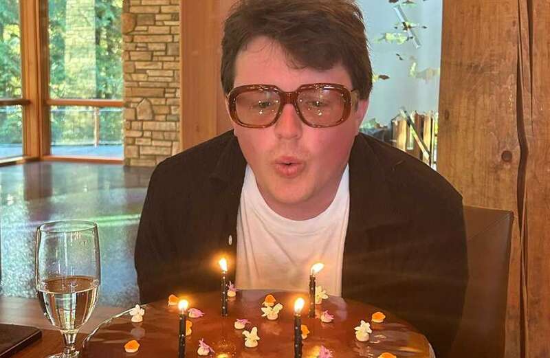 Hollywood star pays tribute to rarely seen lookalike son on his birthday - but can you guess who his famous dad is?