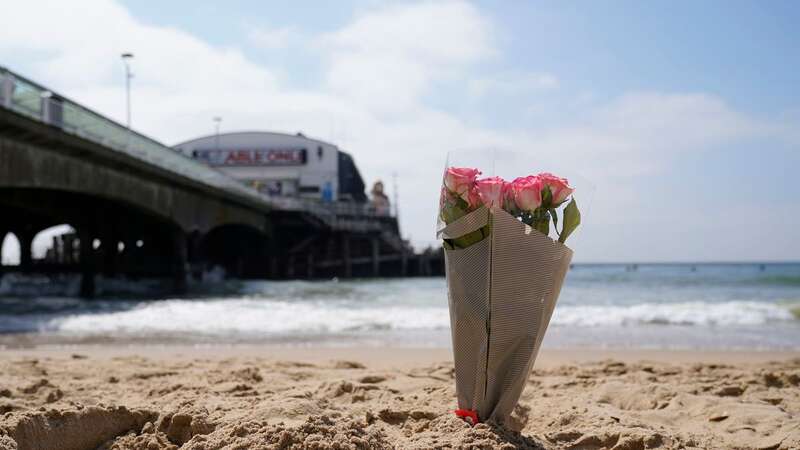 Floral tributes have been left at the beach after two children died earlier this week (Image: PA)