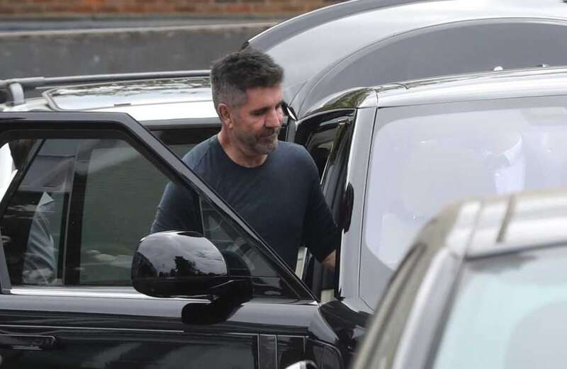 Petrolhead Simon Cowell goes green with £115K black electric Range Rover