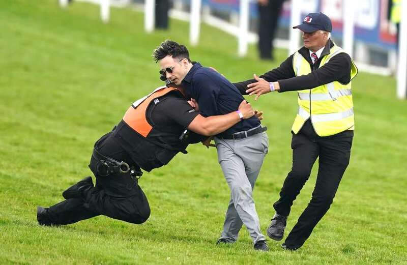 Protestor tackled at Epsom Derby as animal activists' plot is foiled