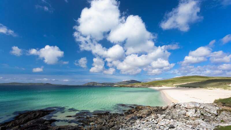 Stunning view over the sandy beach at Rhossili Bay on the Gower Peninsula (Image: Getty)