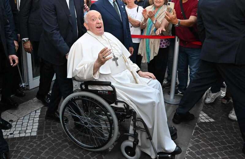 Popes Francis, 86, smiles and waves as he leaves hospital after hernia op