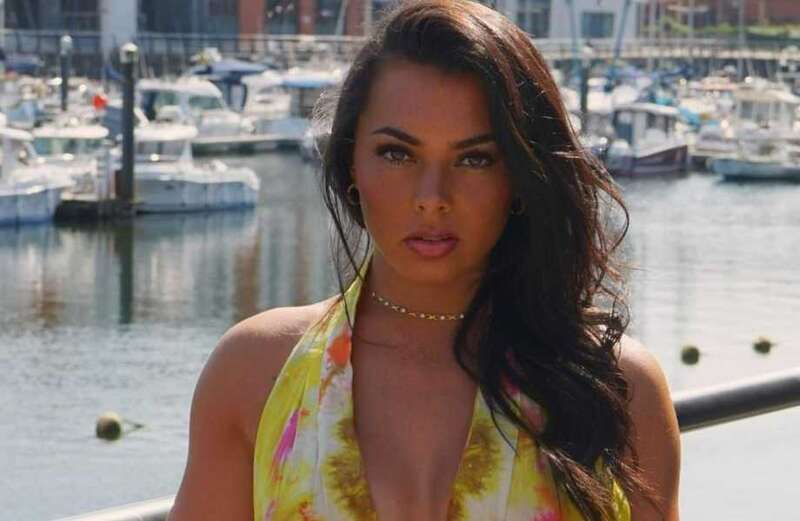 Love Island star Paige Thorne goes braless in plunging summer dress