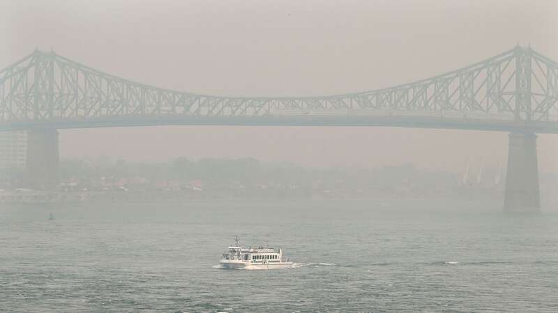 Jacques Cartier bridge obscured by a haze of smog in Montreal (Image: AP)