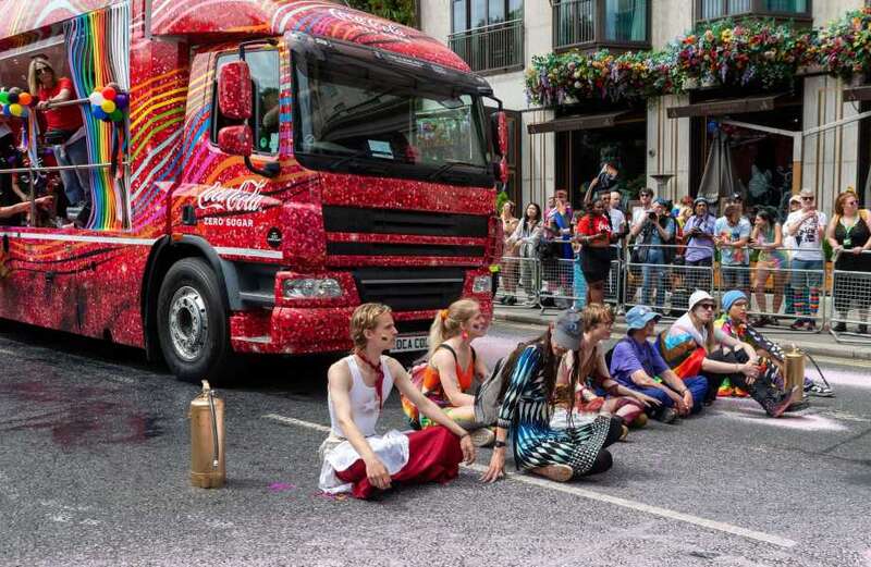 Just Stop Oil yob lays down in front of a truck during Pride in London