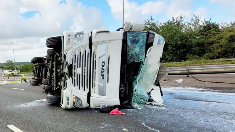 Photos show the tanker on its side with its roof crumpled and caved in (Image: National Highways / SWNS)