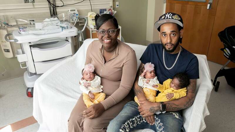 Monique Davaul with her partner and the three babies (Image: Consociate Media)