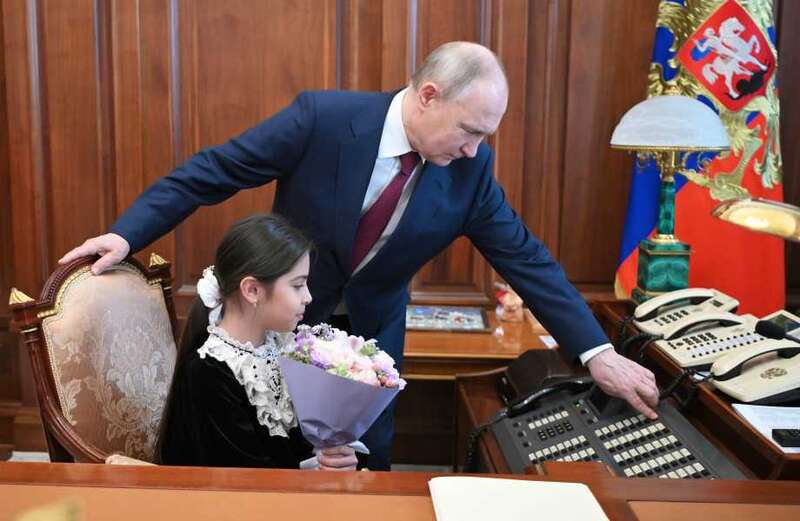 Vladimir Putin launches creepy charm offensive with girl, 8, in Kremlin