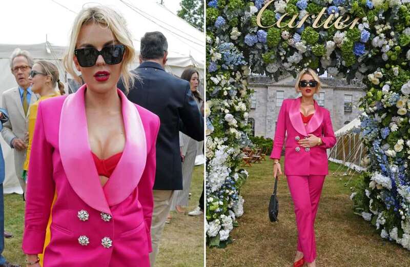 Tallia Storm looks incredible as she flashes bra in plunging pink blazer