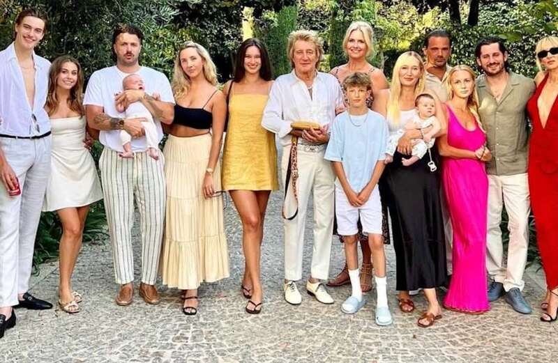 Rod Stewart poses with seven of his eight children during family holiday