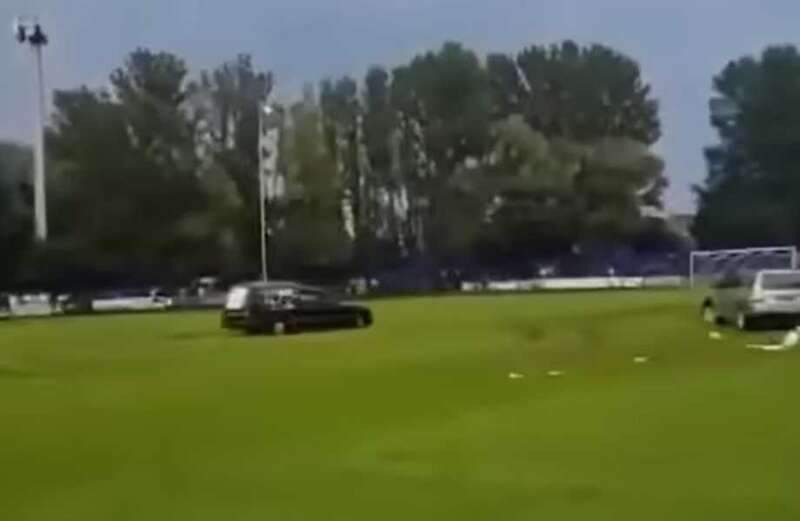 Four arrested after masked men in hearse storm football pitch during match