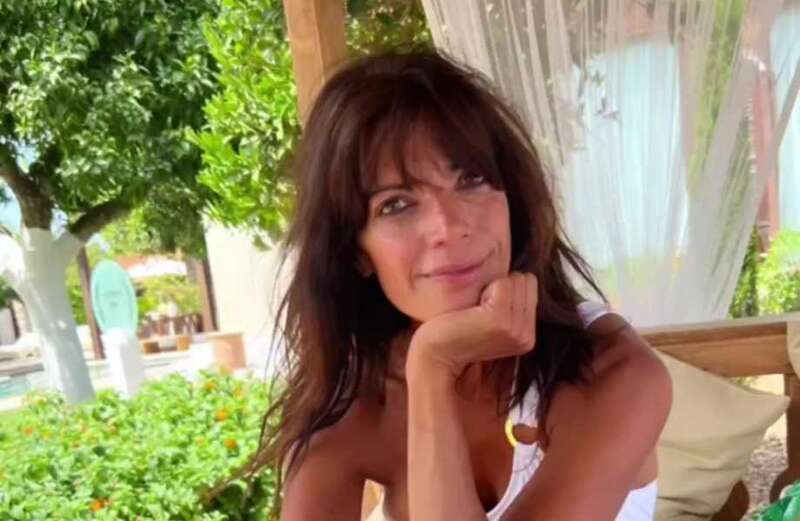 Jenny Powell shows off her boob job and incredible curves in  white swimsuit