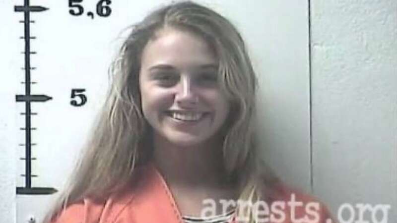 Her latest mugshot post shows her grinning widely with dyed blond hair while wearing an orange prison jumpsuit after being arrested in July 2020