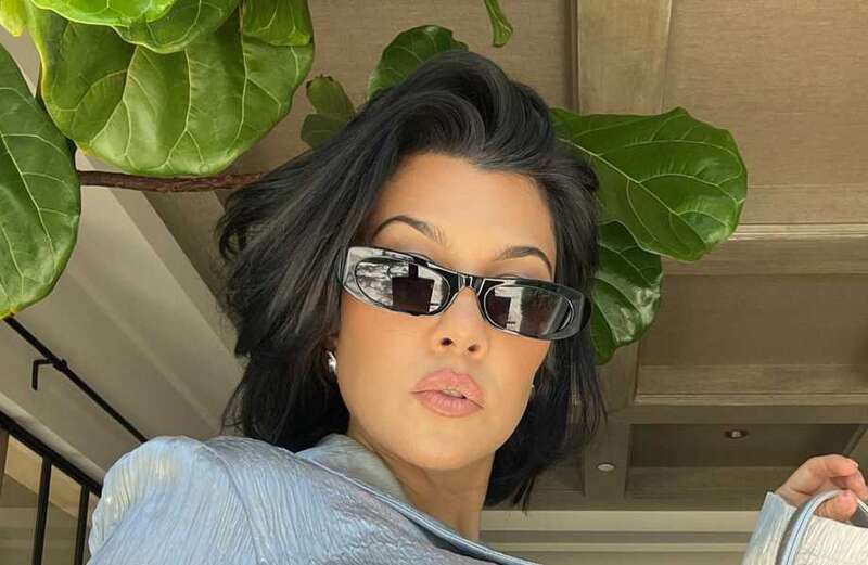 Kourtney watches UFC event in husband Travis' huge backyard at $7M mansion