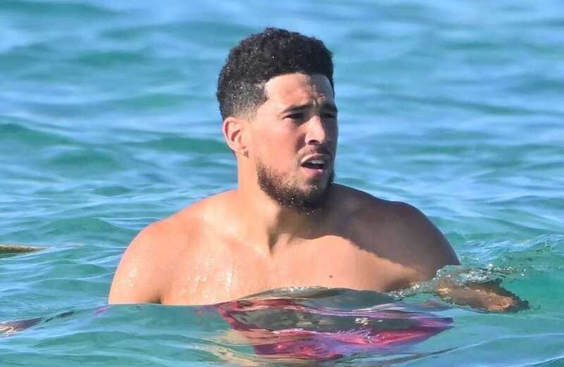 NBA star Devin Booker spotted on yacht with bikini-clad stunners