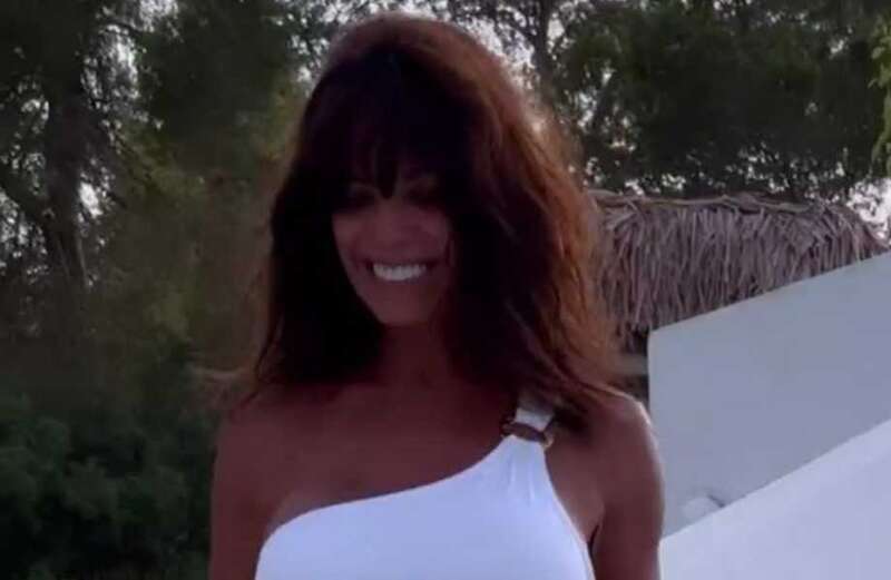 Jenny Powell, 55, strips off to one-shoulder swimsuit on holiday