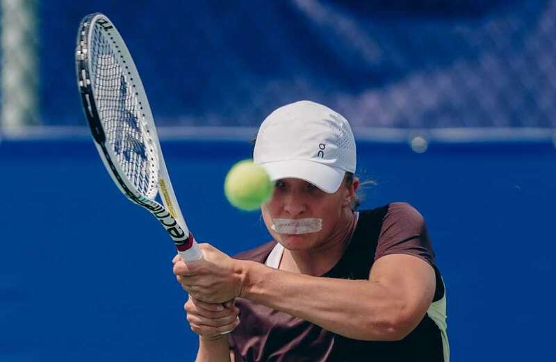 Iga Swiatek baffles tennis fans as she plays with TAPE over her mouth