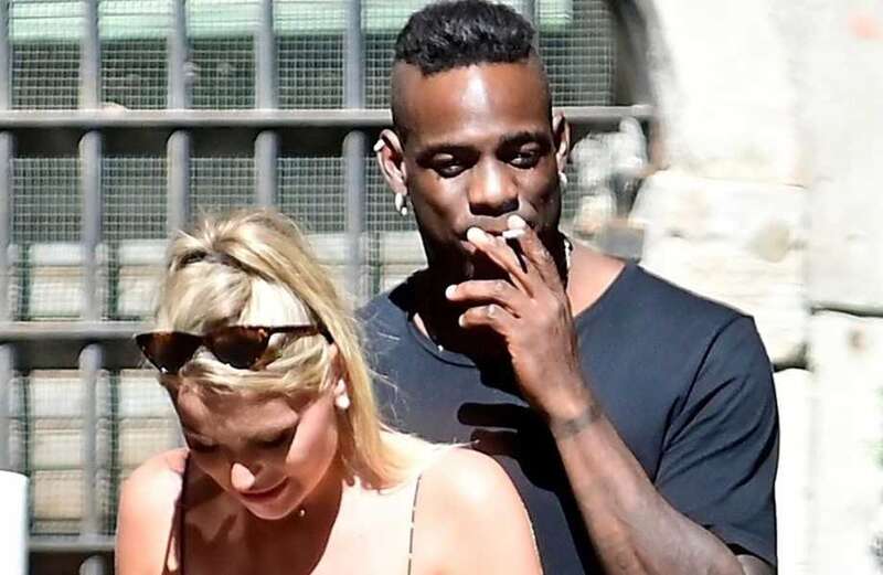 Balotelli puffs on cigarette during romantic Venice trip with mystery blonde