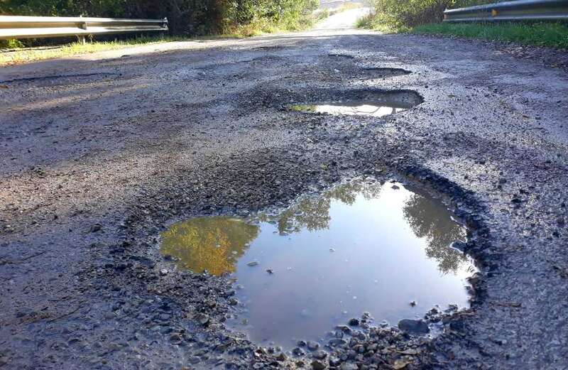 Drivers furious after UK's pothole repair fund slashed from £4bn to £2bn