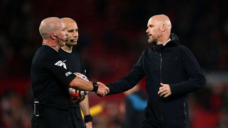 Referee Simon Hooper along with Man Utd boss Erik ten Hag