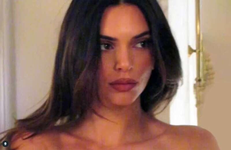 Kendall Jenner goes topless and shows off big pout in new video