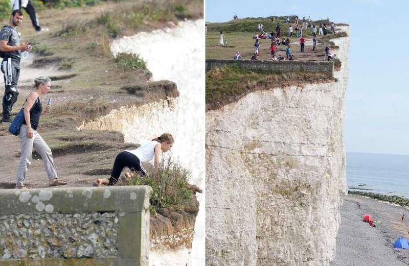 Tourists pose for selfies & teenagers hang over 150ft cliff