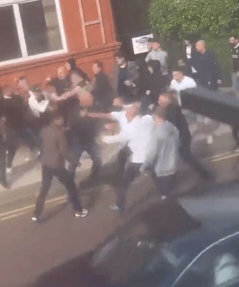 Moment football yobs fight in street during 50-man brawl