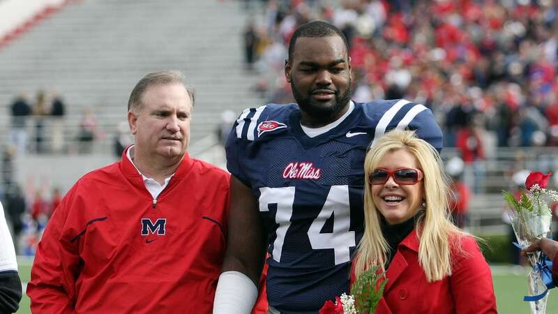 OXFORD, MS - NOVEMBER 28: Michael Oher #74 of the Ole Miss Rebels stands with his family during senior ceremonies prior to a game against the Mississippi State Bulldogs at Vaught-Hemingway Stadium on November 28, 2008 in Oxford, Mississippi. (Photo by Matthew Sharpe/Getty Images)