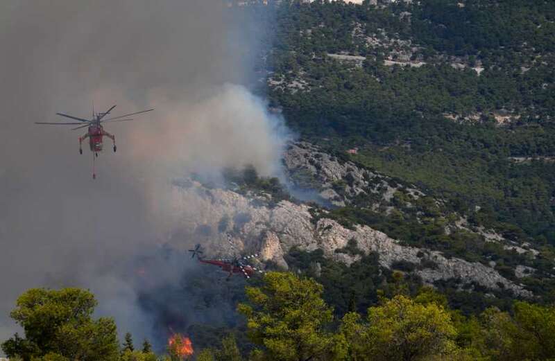 Raging wildfire engulfs Greek military base ‘causing shells to EXPLODE’